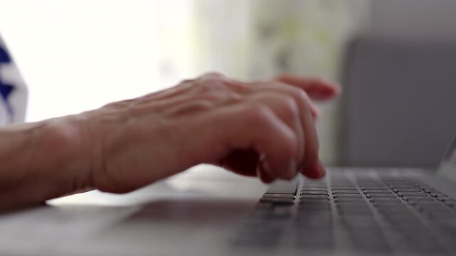 Senior Woman Working on Laptop at Home
