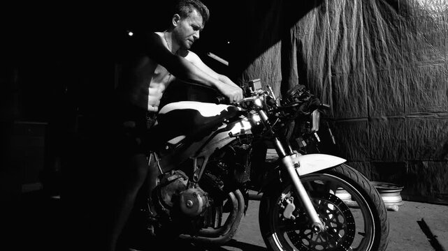 sports retro motorcycle disassembled for repair and adjustment of carburetors, engine start and check at high rpm, testing