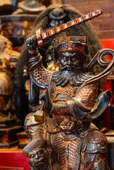 Fototapeta premium A close-up of a wooden statue of the Chinese traditional deity which master ghosts
