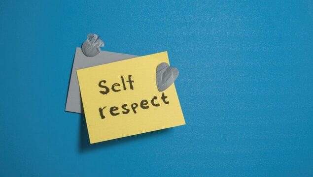 Blue background with copy space and sticky note promoting assertive communication and self respect