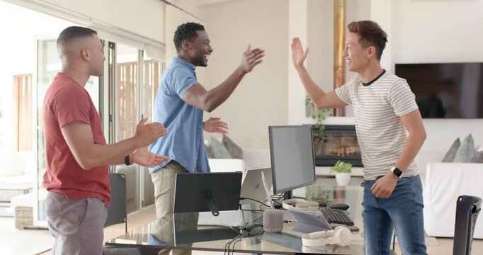 Diverse male coworkers center man clapping sharing handshakes celebrating at desk in home office