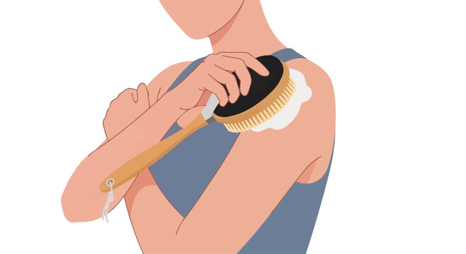 Woman dry brushing shoulder with natural bristle brush for exfoliation and lymphatic drainage