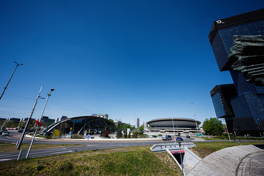 Modern Katowice skyline with Spodek arena and contemporary business towers in Katowice, Poland under a clear blue sky