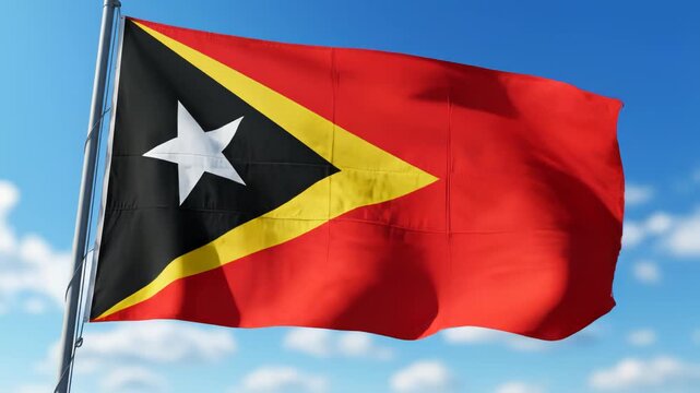 Flag of East Timor waving in sky