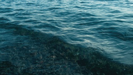 Obraz premium Clear Cold Water with Subtle Waves Afternoon Mood, Tranquil Surface, Cool Tones