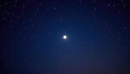 Obraz premium Clear sky at night featuring a glowing moon and countless stars