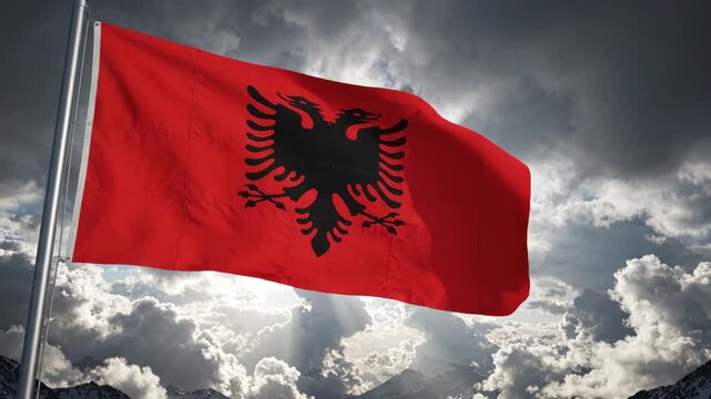 Albanian flag waving in sky