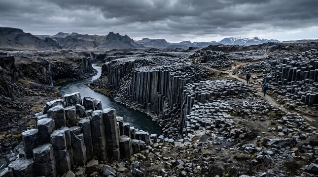A desolate volcanic landscape where cool, hardened black basalt forms geometric hexagonal columns.