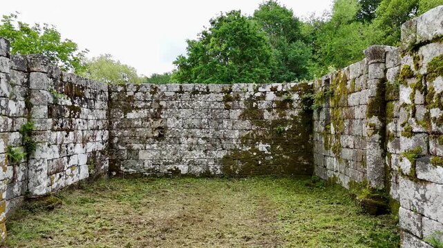 Drone flying up from ancient stone ruins in Forno da Santa Galicia