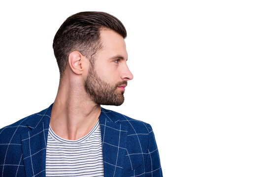 Photo of man looking into empty space showing the result of his hairstylist work with bristle on face turning head side profile isolated grey color background