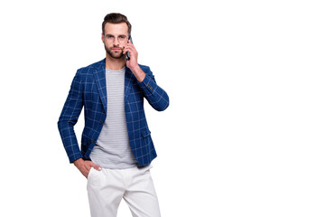 Fototapeta premium Photo of serious confident man with hand in white trousers pants pocket standing near empty space isolated over grey color background