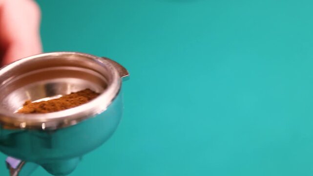 Coffee portafilter isolated on green background espresso brewing equipment