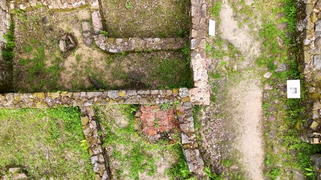 Drone flying up revealing the Castro de Armea ruins
