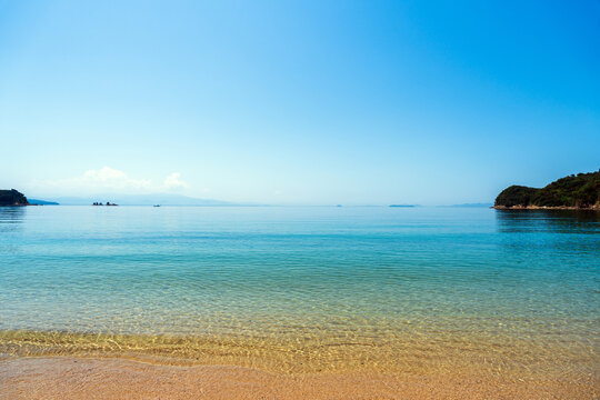Calm shallow waters of Seto Inland Sea sandy beach Kure Hiroshima Japan