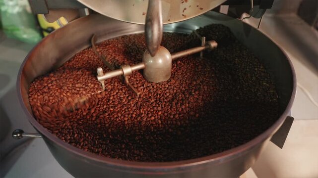 Industrial cooling tray stirring large batch of roasted coffee