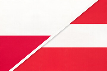 Naklejka premium Poland and Austria national flags on fabric background, international partnership and cooperation between two countries