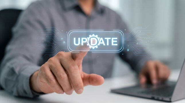Man touching digital update button with gear icon on screen