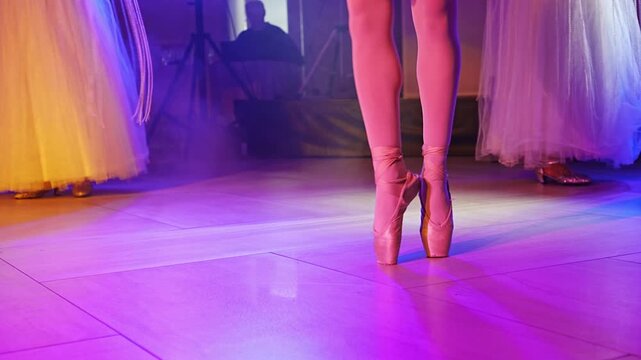 Ballet performance in a studio with dancers in colorful costumes