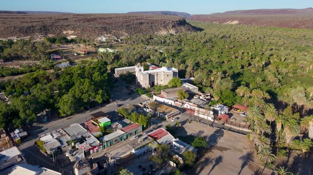 Discover the aerial views of Mission Church in San Ignacio, Baja California Mexico, highlighting the oasis town and surrounding nature.