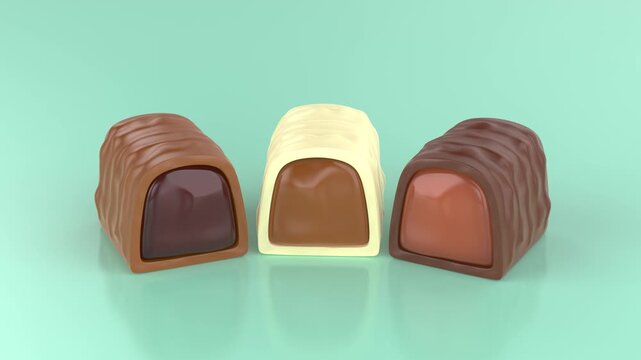 White, dark and milk chocolate bonbons with caramel, cherry and chocolate cream inside