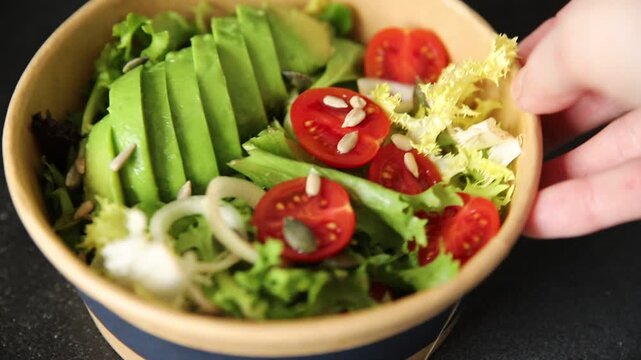 Avocado bowl vegetable salad lunch or dinner tasty snack organic fresh and gourmet food background on the table, rustic food, top view, copy space keto and paleo diets vegetarian and vegan food