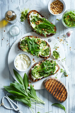 Wild Garlic Pesto Toast with Cream Cheese and Pine Nuts &ndash; Spring Herb Food Photography