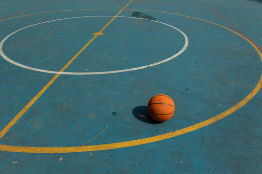 Basketball on a sports court with copy space. Concept of training, competition, physical activity, urban sports, and a healthy lifestyle