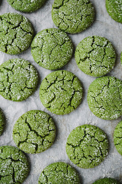 Matcha cookies sprinkled with sugar on a baking tray