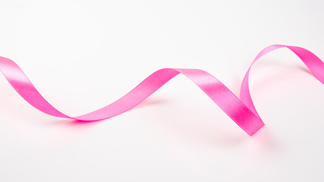 Abstract shape color pink ribbon isolated on white background.  top view