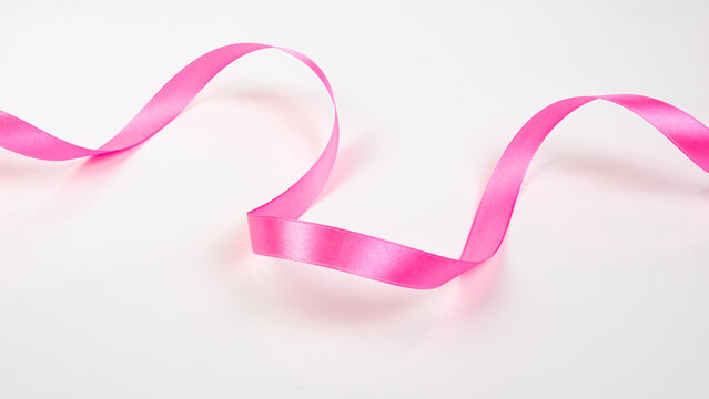 Abstract shape color pink ribbon isolated on white background.  top view