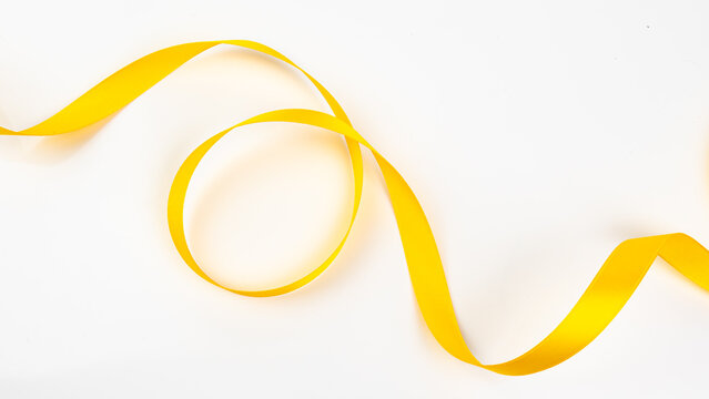 Abstract shape color yellow ribbon isolated on white background.     top view