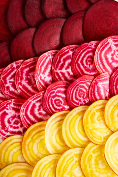 Red, pink and yellow beetroot slices pattern