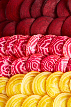 Red, pink and yellow beetroot slices pattern