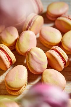 Pink and Yellow Macarons Shaped Like Easter Eggs