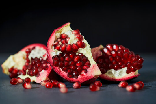 Pomegranate Sliced Open on a Dark Background