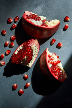 Pomegranate Sliced Open on a Dark Background