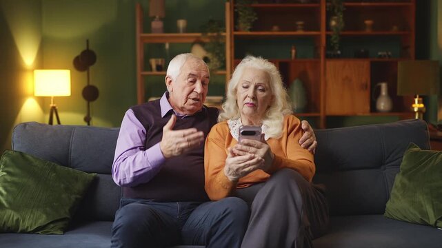 Senior spouses talking with a physician on phone during medical consultation
