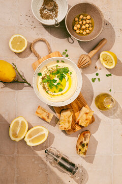 Hummus dip in a bowl, high key