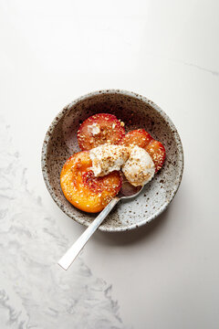Stewed peaches served with mascarpone and a sprinkle of dukkah