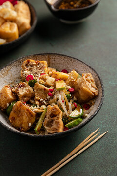 Malaysian rojak salad with tofu, cucumbers, sprouts, and spicy sauce