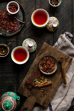 Spiced tea and botanicals arranged for a warm, cozy brew
