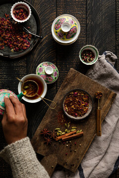 Spiced tea and botanicals arranged for a warm, cozy brew