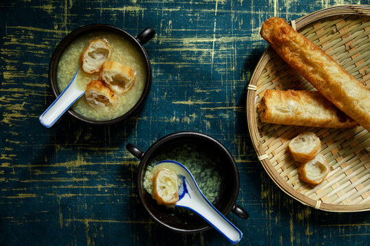 Tau suan mung bean dessert served warm with crispy youtiao pieces