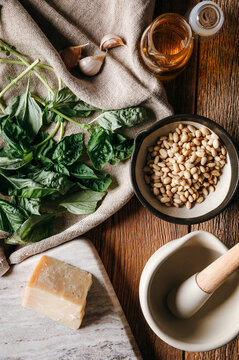 Ingredients arranged for making fresh basil pesto