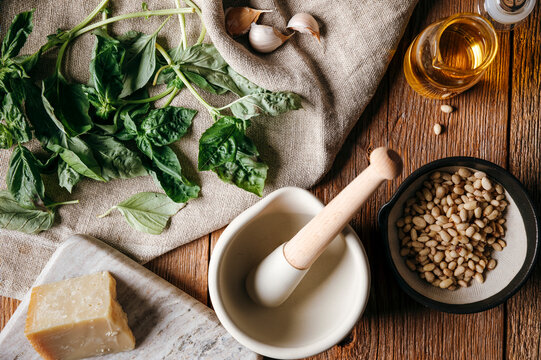 Ingredients arranged for making fresh basil pesto