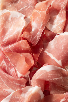 Macro shot of thinly sliced prosciutto meat