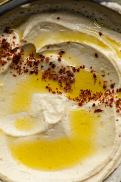 Homemade hummus with olive oil and Aleppo pepper
