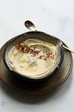 Homemade hummus with olive oil and Aleppo pepper