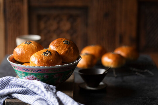 Soft golden buns filled with Nutella, topped with sesame seeds.