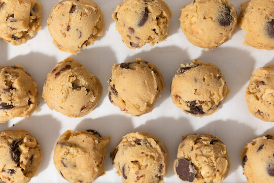 Chocolate chip cookie dough balls on white background